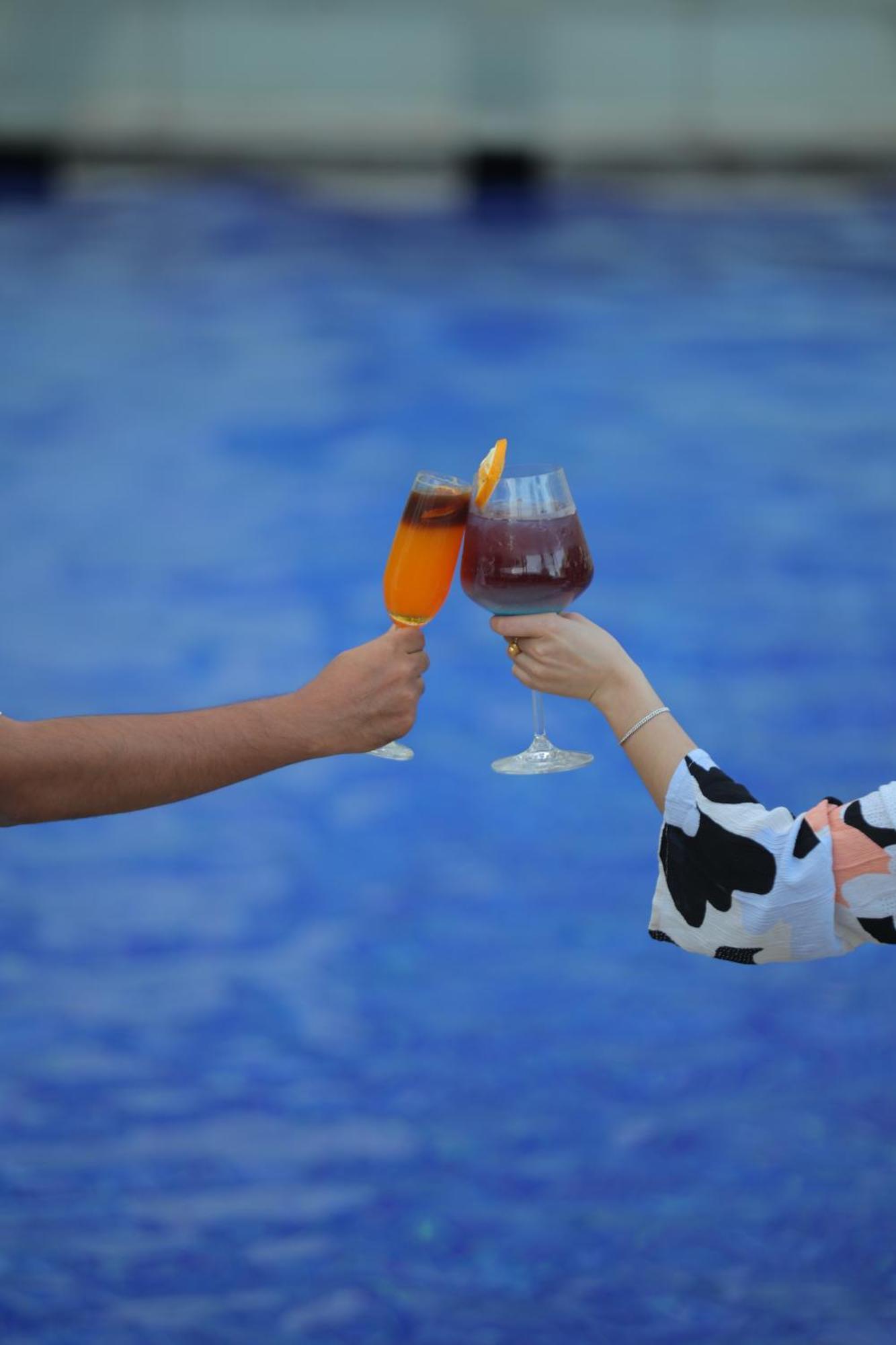 Novotel Hyderabad Airport Экстерьер фото A toast with two glasses